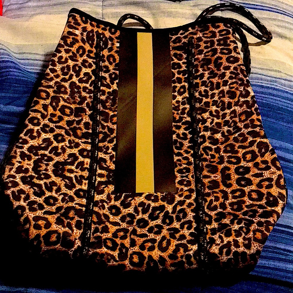 Leopard print bag with a mini purse. New with tags.